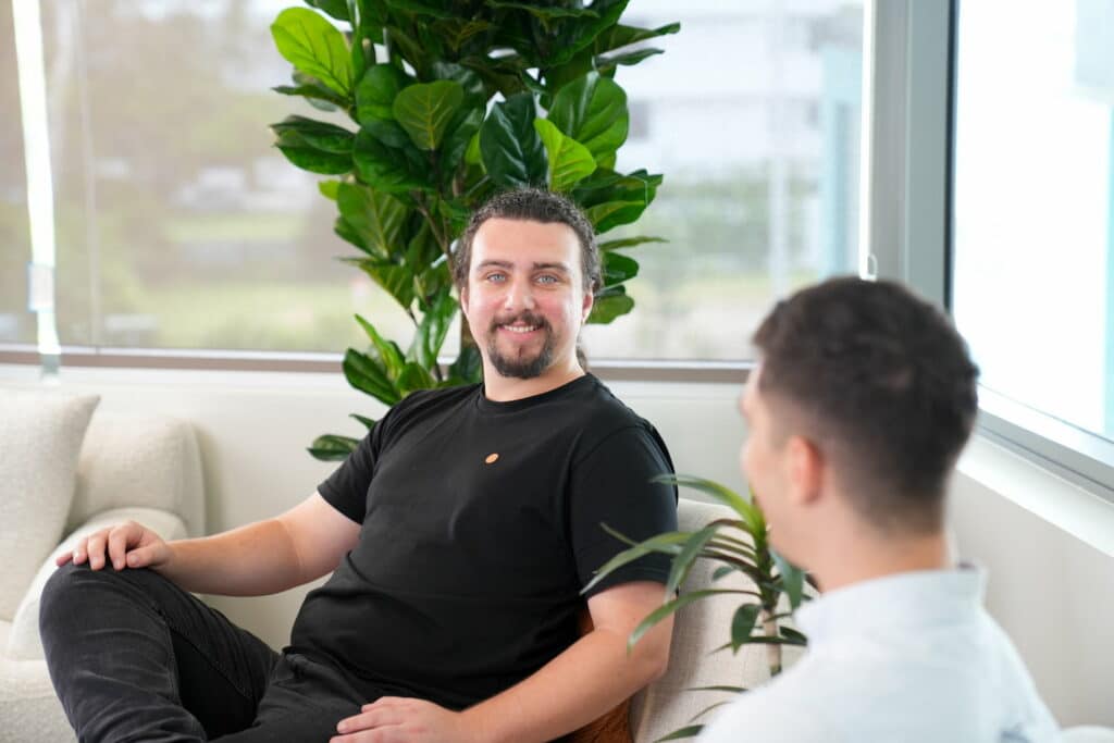 Web developers Hayden & Mitch having an internal staff meeting